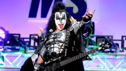 Musician Gene Simmons of  the rock band KISS performs onstage in Beverly Hills, Calif., in 2016 as he flashes the famous hand symbol he’s trying to trademark. It looks like the devil’s horns  or metal horns sign, but it’s actually the symbol for ‘I love you’ in sign language