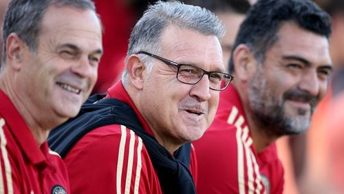 June 6, 2018 Kennesaw: Atlanta United head coach Gerardo Martino shares a laugh with his assistant coaches while playing Charleston Battery during the first half in a U.S. Open Cup match on Wednesday, June 6, 2018, in Kennesaw.  Curtis Compton/ccompton@ajc.com