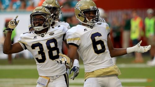 Georgia Tech's Lamont Simmons (6) celebrates his 42-yard touchdown return of an onside kick against Miami Saturday.  (Mike Ehrmann/Getty Images)
