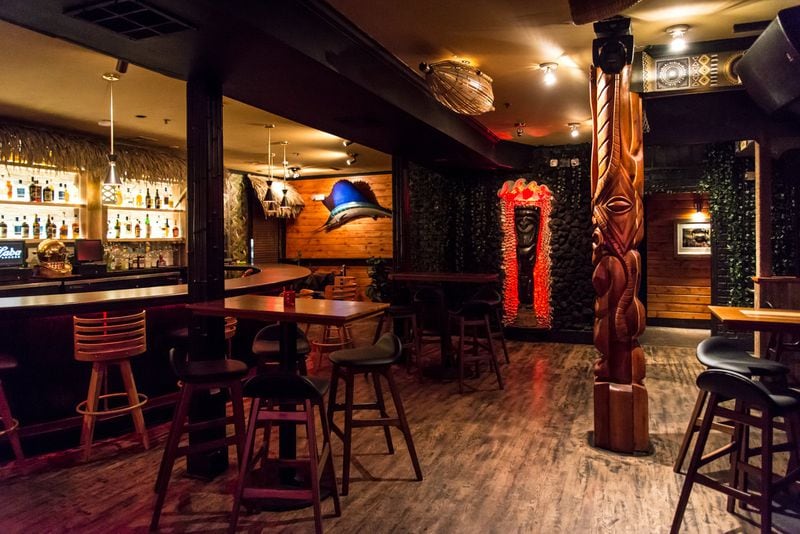 Tiki Tango “Main Deck” bar with Tiki idols hand-carved by Frank Simotics. Photo credit- Mia Yakel.