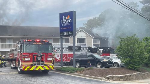 Gwinnett County firefighters extinguished a blaze at an InTown Suites that displaced about 50 people.