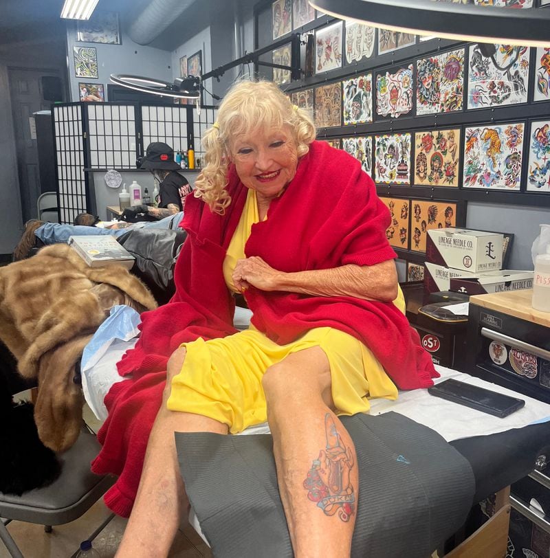 Zelda Robinson poses with her new Duke's Mayo-inspired tattoo at Yellow Bird Tattoo in Richmond, Virginia.
