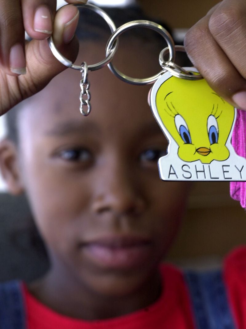 FILE PHOTO: (MARIETTA, GA.) In this Wednesday 9/27/00 portrait photo we see Ashley Smith, 11, holding the remnants of a chain on her keyring that got her suspended from the school for 10 days. The school's principal told Ashley and her parents that the chain violated the school district's "zero tolerance" policy on weapons. What Ashley is holding in this photo is what is left of the chain. School officials removed several inches of the chain (approximately 3-4 inches, according to Ashley and her parents) before giving it back to Ashley as you see it here in this photo. PHOTO BY ANDY SHARP/STAFF.