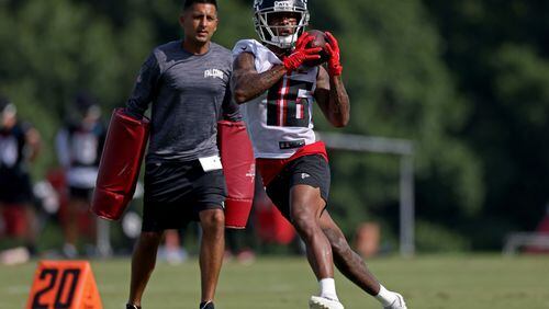 Atlanta Falcons wide receiver Cameron Batson (16) makes a catch during the first day of Falcons training camp at the Falcons Practice Facility Wednesday, July 27, 2022, in Flowery Branch. (Jason Getz / Jason.Getz@ajc.com)