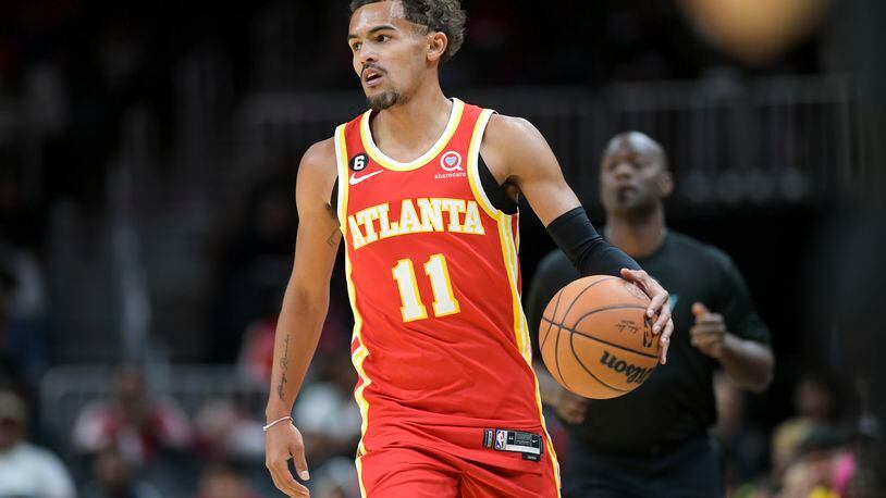 Hawks guard Trae Young (11) looks for an opening in the defense during a scrimmage game Wednesday, September 28, 2022 at State Farm Arena. (Daniel Varnado/For the AJC)