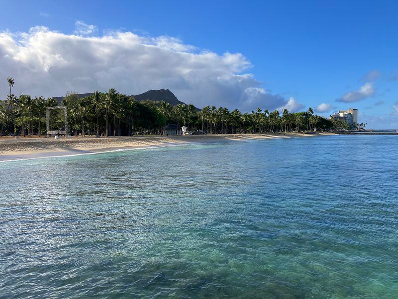 The majestic Diamond Head crater towers over the blue Pacific waters of Waikiki Beach.
(Courtesy of H.M. Cauley)