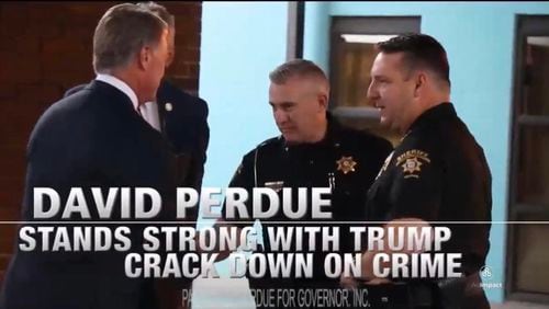 Republican David Perdue swapped out an image of a disgraced sheriff’s deputy in his latest TV ad. The spot flashed an image of Perdue shaking the hand of Grady Sanford, a former Forsyth County chief deputy who was charged in November 2020 with multiple counts related to child pornography. The charges are still pending.