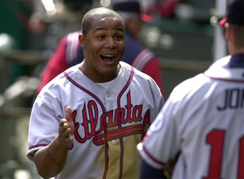 Braves Andruw Jones, left, laughes while celebrating a win over the Cincinnati Reds with Chipper Jones, right. Andruw Jones hit a home-run in the 6th inning of the 10-4 victory over the Reds. (SUNNY SUNG/STAFF)