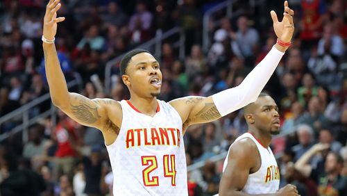 April 24, 2017, Atlanta: Atlanta Hawks Kent Bazemore and Paul Millsap look to the crowd to celebrate during a 111-101 victory over the Washington Wizards in game 4 of a first-round NBA basketball playoff series on Monday, April 24, 2017, in Atlanta. Curtis Compton/ccompton@ajc.com