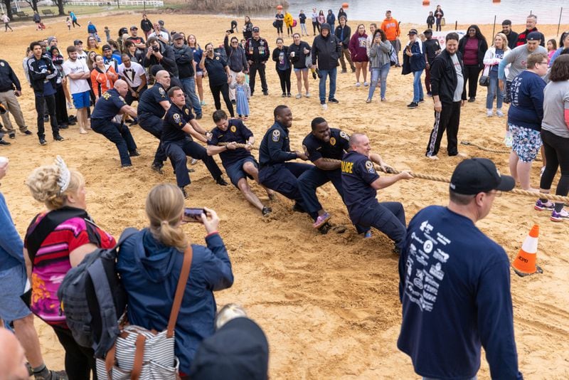 Teams participate in the tug of war tournament during the Polar Plunge in Acworth in 2023. The annual event at Acworth Beach helps fund year-round sports training and competition for Special Olympics Georgia athletes. (Photo: Steve Schaefer / steve.schaefer@ajc.com)