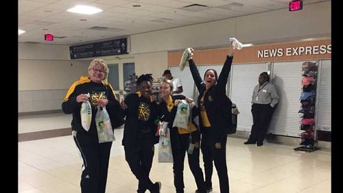 Members of the Kennesaw State University women's basketball team make the most of their time stuck during Sunday's power outage at Hartsfield-Jackson Atlanta International Airport. PHOTO CREDIT: KENNESAW STATE UNIVERSITY