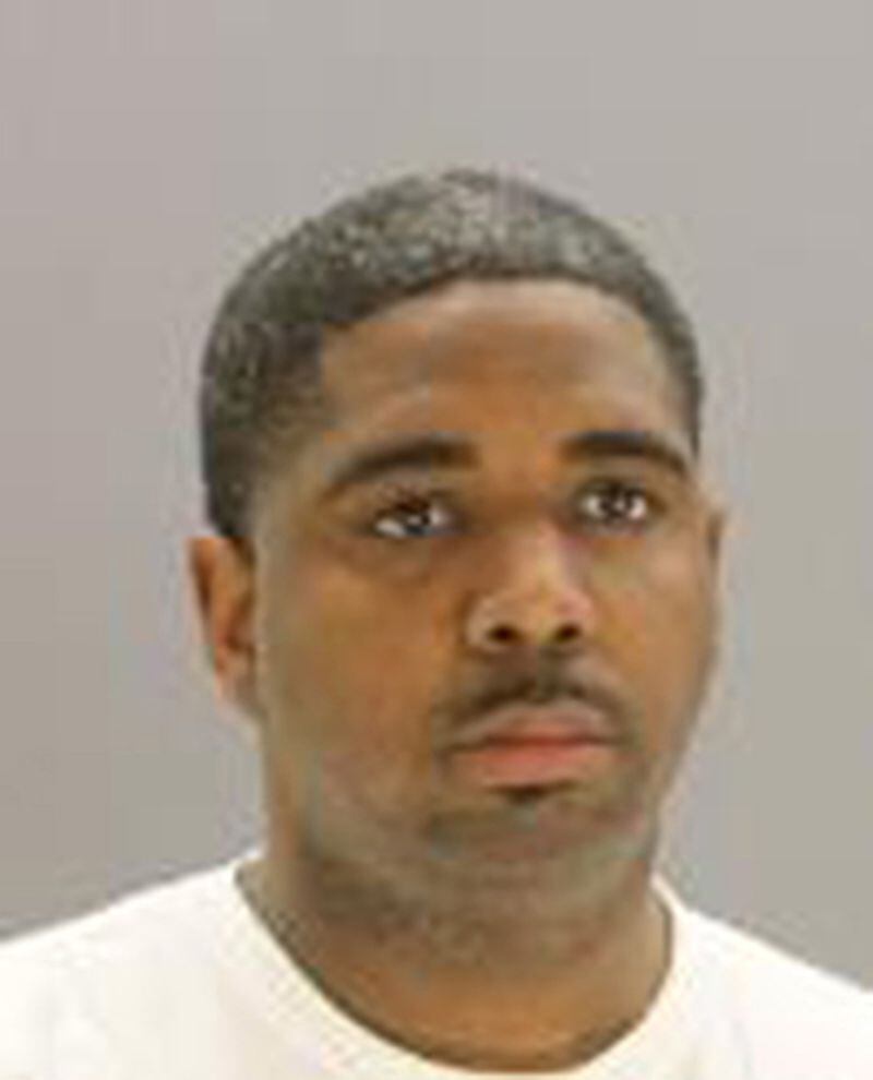 A photo provided by Dallas County Sheriff’s Department shows Officer Bryan Riser of the Dallas Police Department during a 2017 arrest in which he was charged with assault family violence, a misdemeanor. The Dallas police officer was arrested Thursday and charged with two counts of capital murder after a witness said the officer had instructed him to kidnap and murder two people in 2017, the city’s police chief said.