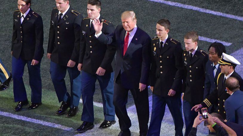 January 8, 2018 Atlanta - President Donald Trump attends during College Football Playoff National Championship at Mercedes-Benz Stadium on Monday, January 8, 2018. HYOSUB SHIN / HSHIN@AJC.COM