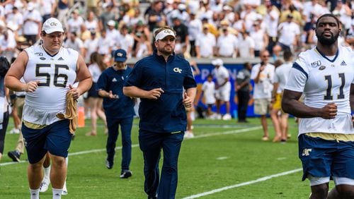 Georgia Tech general manager Patrick Suddes (middle) was hired to lead recruiting efforts for coach Geoff Collins in January 2019. (Danny Karnik/Georgia Tech Athletics)