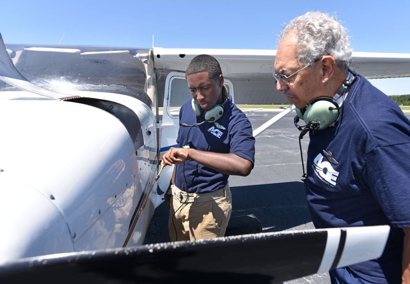 Leon Shields was just one month shy of obtaining his pilot’s license when he died. In this photo from 2015, Julius Alexander, the founder of Aviation Career Enrichment, supervises as Leon performs a checkup of a 1964 CESSNA 172F at The ACE Academy in 2015. HYOSUB SHIN / HSHIN@AJC.COM