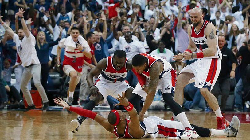 Washington Wizards players mob Paul Pierce on the floor after his game winning shot as time expired after Game 3 of the second round of the NBA basketball playoffs Saturday, May 9, 2015, in Washington. The Wizards won 103-101. Curtis Compton/ccompton@ajc.com