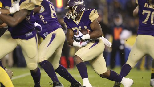 Atlanta Legends running back Lawrence Pittman (24) rushes for a short gain in the first half of an AAF football game between the Atlanta Legends and the San Diego Fleet, Sunday, Feb. 17, 2019, at SDCCU Stadium in San Diego, Calif. (Peter Joneleit via AP Photo)