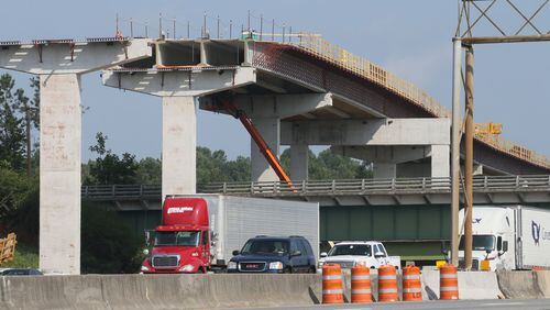 Construction is ongoing for the Northwest Corridor express lane project, which will add 29.7 miles of reversible toll lanes in the I-75/I-575 corridor. BOB ANDRES/BANDRES@AJC.COM