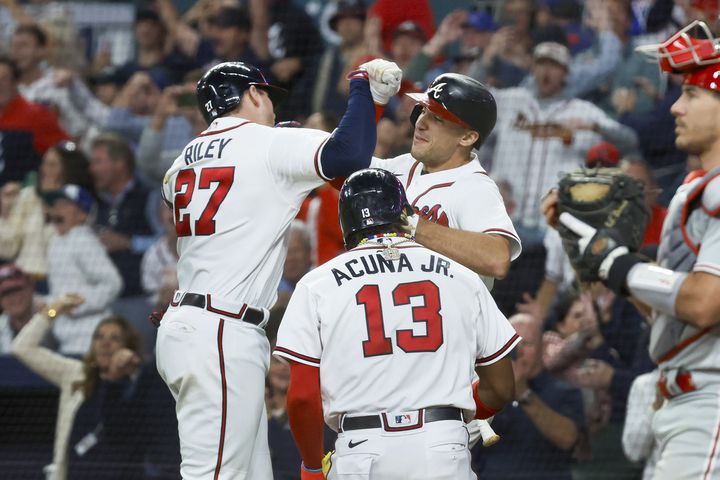 Atlanta Braves third baseman Austin Riley (27) celebrates after a two-run home run against the Philadelphia Phillies during the eighth inning of NLDS Game 2 in Atlanta on Monday, Oct. 9, 2023.   (Miguel Martinez / Miguel.Martinezjimenez@ajc.com)