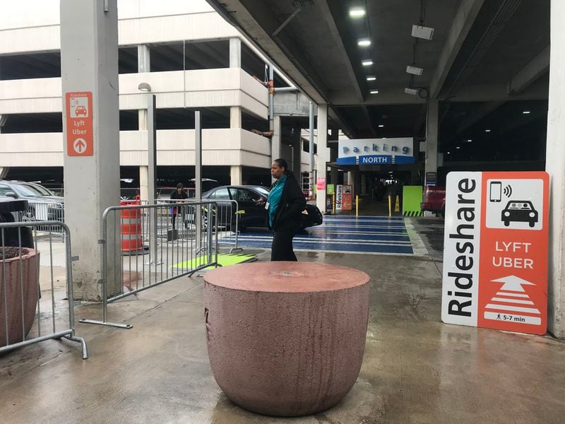 At the domestic Terminal North at Hartsfield-Jackson International Airport, after taking an escalator/elevator down to the  lower level and  exiting at lower level door LN1, signs direct passengers to the new rideshare lot to the left.