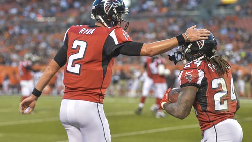 Falcons quarterback Matt Ryan celebrates after running back Devonta Freeman scores the game's first touchdown in the first quarter of Thursday's exhibition game against Cleveland. (AP photo)