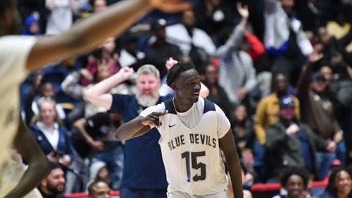 March 12, 2022 Macon - Norcross' Jerry Deng (15) celebrates after dunking the ball at the end of the 4th quarter during the 2022 GHSA State Basketball Class AAAAAAA Boys Championship game at the Macon Centreplex in Macon on Saturday, March 12, 2022. Norcross won 58-45 over Berkmar. (Hyosub Shin / Hyosub.Shin@ajc.com)