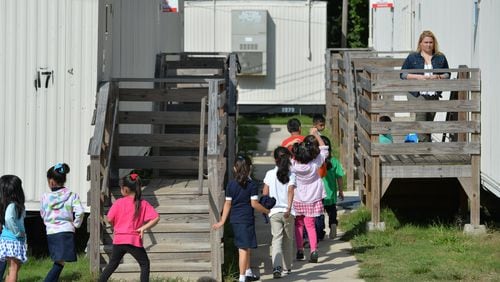 At Cary Reynolds Elementary School in Doraville, dozens of portable classrooms accommodate the overflow of students. (AJC FILE PHOTO)