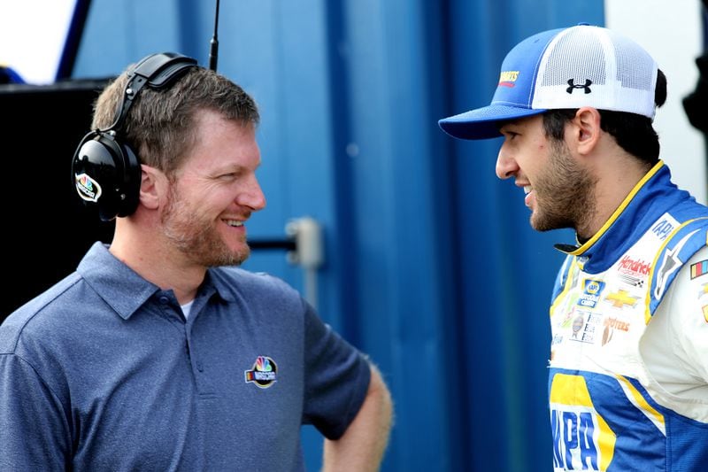 BROOKLYN, MI - AUGUST 11: Chase Elliott, driver of the #9 NAPA Auto Parts Chevrolet, speaks with former NASCAR driver, Dale Earnhardt Jr., during practice for the Monster Energy NASCAR Cup Series Consmers Energy 400 at Michigan International Speedway on August 11, 2018 in Brooklyn, Michigan.  (Photo by Jerry Markland/Getty Images)