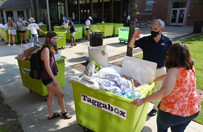 Georgia Tech President Angel Cabrera talks with Sophia Bowie, 18, a first-year Computer Science major, and her mother, Pam Bowie (right) of Chicago, as he helps them moving in outside Glenn Hall on the Georgia Tech campus on Saturday, Aug. 8, 2020. (Hyosub Shin / Hyosub.Shin@ajc.com)
