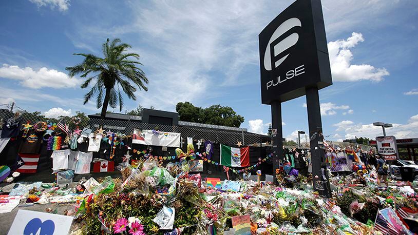 This July 11, 2016, file photo shows a makeshift memorial outside the Pulse nightclub in Orlando, Fla., one month after the shooting that killed 49 people.