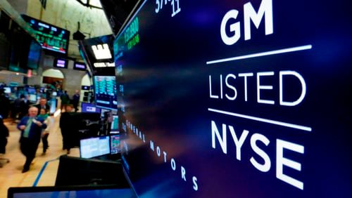 FILE - In this April 23, 2018, file photo, the logo for General Motors appears above a trading post on the floor of the New York Stock Exchange. General Motors reports earnings on Tuesday, April 23, 2024. (AP Photo/Richard Drew, File)