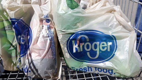In this June 15, 2017 file photo, bagged purchases from the Kroger grocery store in Flowood, Miss., sit inside a shopping cart. (AP Photo/Rogelio V. Solis, File)