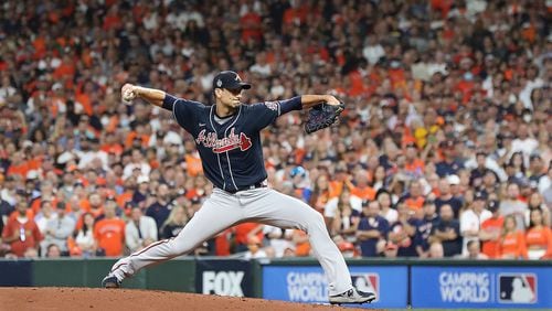 102621 HOUSTON: Braves starting pitcher Charlie Morton delivers against the Astros during the first inning in game 1 of the World Series on Tuesday, Oct. 26, 2021, in Houston.   “Curtis Compton / Curtis.Compton@ajc.com”
