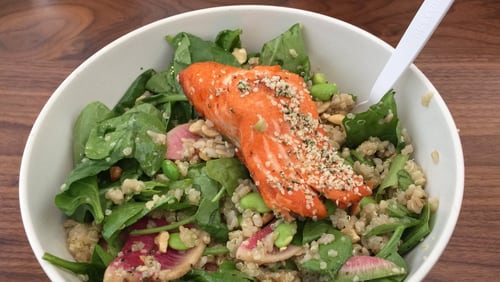 Upbeet’s Oh-Mega grain bowl includes brown rice, quinoa, spinach, edamame, hemp seeds, cashews, watermelon radishes and other tasty tidbits, but the star is the slab of sustainable steelhead trout. CONTRIBUTED BY WENDELL BROCK