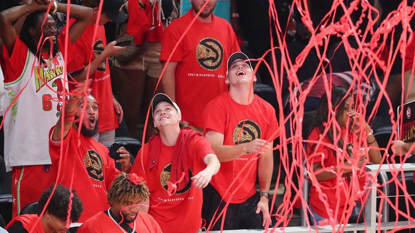 Confetti falls from the ceiling as Atlanta Hawks fans celebrate a 110-88 victory over the Milwaukee Bucks.   “Curtis Compton / Curtis.Compton@ajc.com”