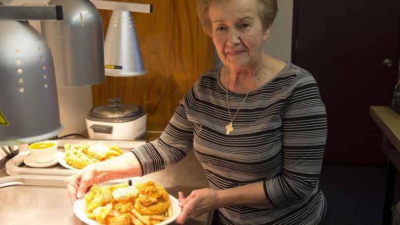 Sue Cheramie, owner and chef at Leeville Seafood Restaurant, prepares a seafood platter, Leeville, La. (Dave G. Houser/TNS)