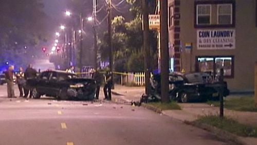Police investigate the scene of an incident on McDaniel Street in Atlanta that involved multiple gunshots, a head-on collision, one person dead and at least six injured.