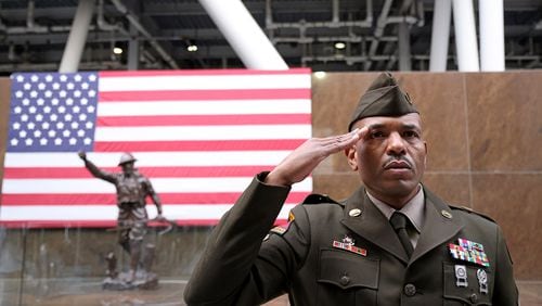 Sgt. 1st Class Keith Greenwood salutes during a Veterans Day event at Soldier Field on Nov. 11, 2022, in Chicago. Veterans Affairs plans to slash reimbursements for the ambulances that transport veterans to medical facilities. (Michael Blackshire/Chicago Tribune/TNS)