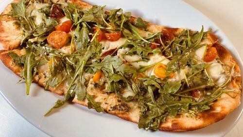 The Garden flatbread is topped with creamy spinach and artichoke sauce, cherry tomatoes, melted mozzarella and fresh arugula at Taffer’s Tavern.
Bob Townsend for the Atlanta Journal-Constitution.