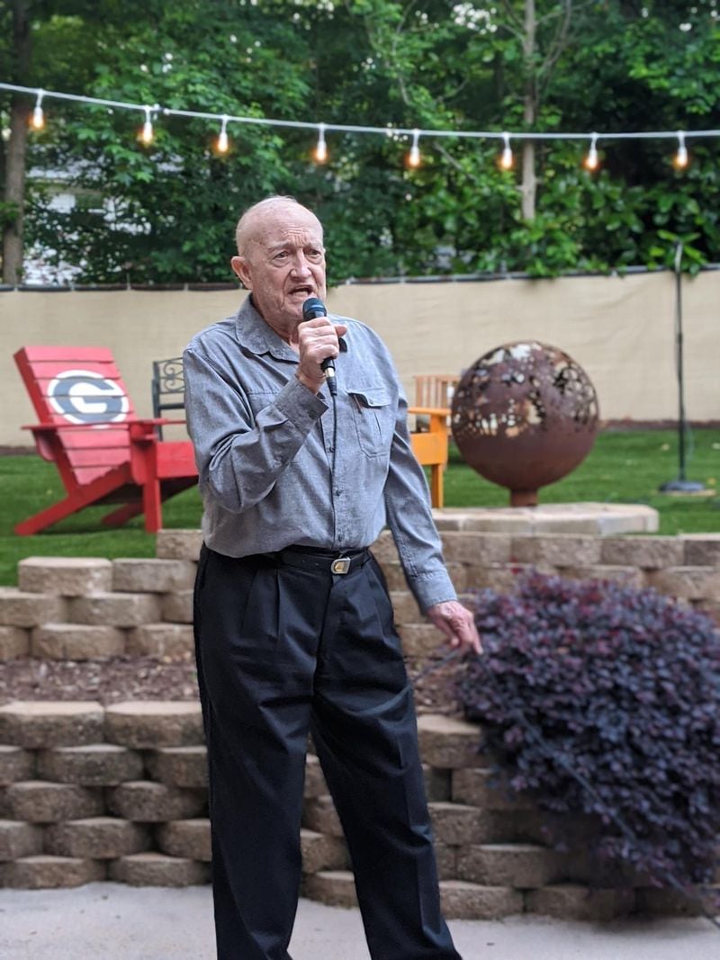 George Jobe, 91 and a retired Lt. Col. in the Air Force, belts out his favorite country hits at karaoke night at his granddaughter’s backyard. Contributed by Penny Bonner