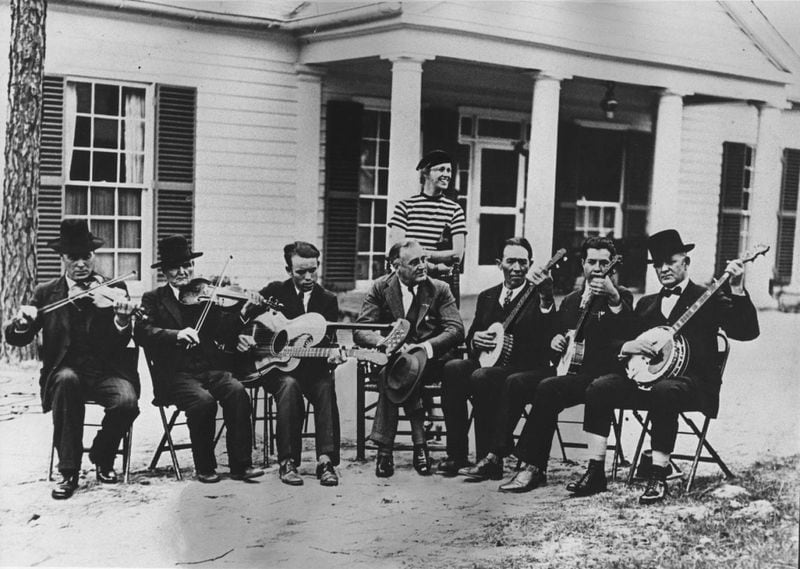 President Franklin Delano Roosevelt sits among several country musicians on the front yard of his retreat home, the Little White House in Warm Springs, Georgia. Jim Frazer/Atlanta Journal-Constitution