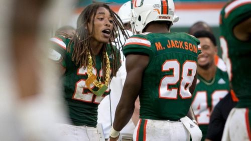 Miami Hurricanes defensive back Sheldrick Redwine (22) earns the "Turnover Chain" after recovering a fumble by Toledo Rockets quarterback Logan Woodside (11) at Hard Rock Stadium in Miami Gardens, Florida on September 23, 2017.  (Allen Eyestone / The Palm Beach Post)