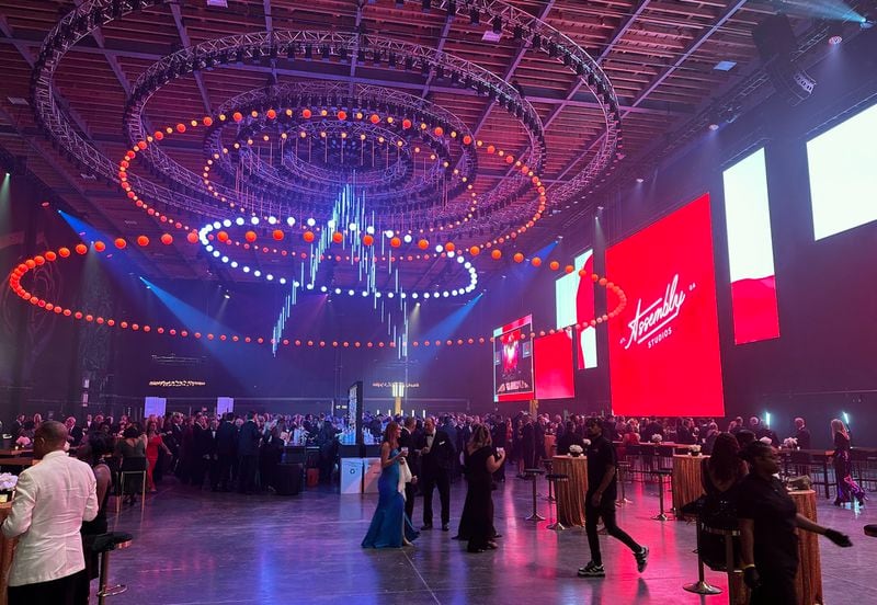 The interior of the Assembly opening gala Oct. 21, 2023 at Doraville featured a moving light show and massive screens as well as an open bar. RODNEY HO/rho@ajc.com
