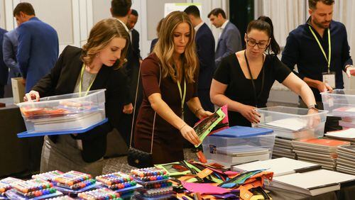 OppenheimerFunds employees assemble supplies to benefit the Boys & Girls Clubs of Metro Atlanta’s arts, teen services, healthy lifestyles and learning center programs.