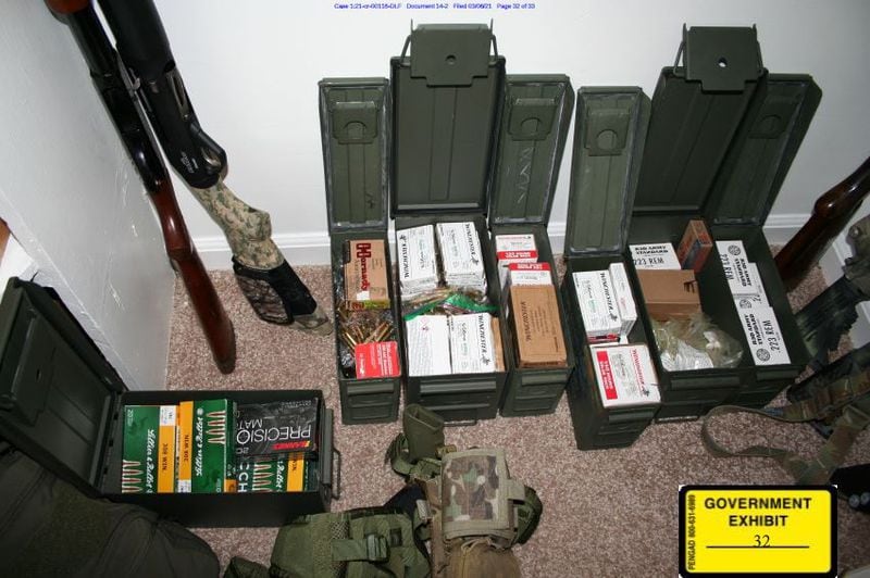 A photo taken by the FBI investigators shortly after the 2021 arrest of Americus attorney William McCall Calhoun Jr. shows an arsenal of guns and ammunition seized during his arrest.
