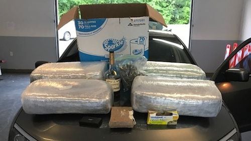 Police found 91.5 pounds of marijuana and two pounds of cocaine in a drug bust.