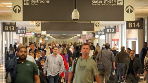 Passengers walk through Concourse B as they travel through Hartsfield-Jackson Atlanta International Airport Tuesday morning in Atlanta, Ga., April 23, 2013.