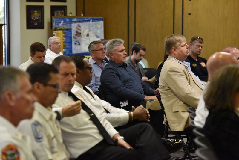 Audience members listen as members of a task force discuss ambulance service in DeKalb County. The task force was assigned by the Region III EMS Council to recommend how ambulance service is provided in the county. HYOSUB SHIN / HSHIN@AJC.COM