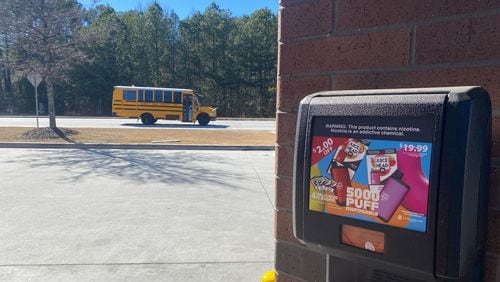 A gas station in Lawrenceville advertises fruit-flavored disposable vape devices. The devices are not authorized for sale by the U.S. Food and Drug Administration. The gas station is near three Gwinnett County high schools. (Josh Reyes / Josh.Reyes@ajc.com)