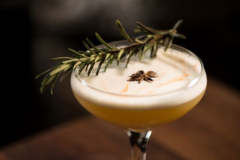  Rose + Rye Men Without Women cocktail with Yellow Rose Bourbon, Egg White, Strega, Rosemary Syrup, and Bitters. / Photo credit- Mia Yakel.